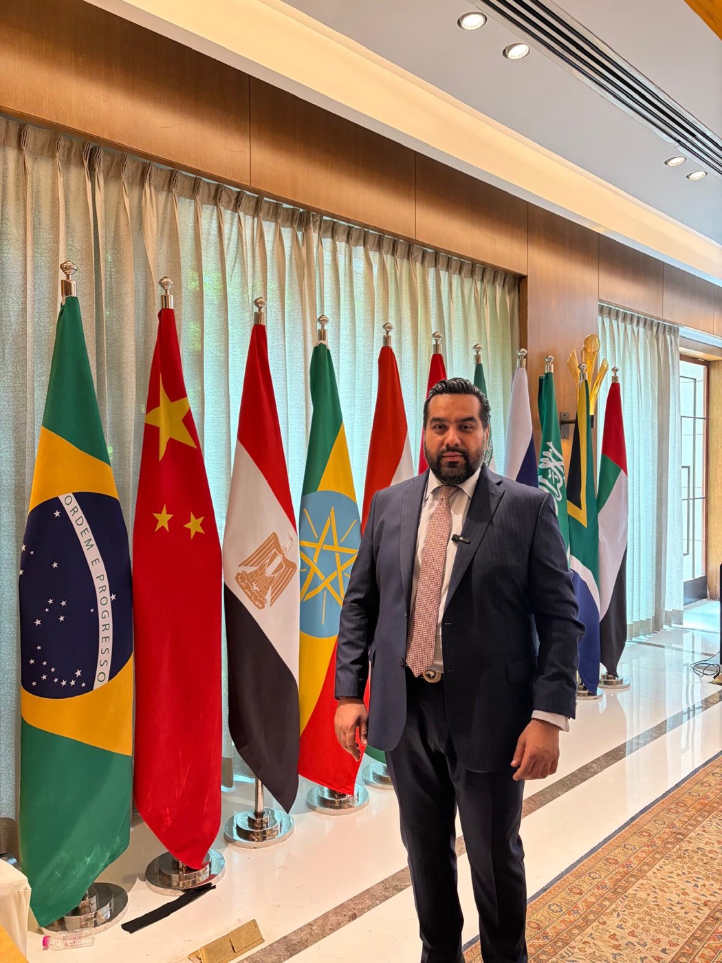 Dushyant Khanna among the BRICS nation flags in New Delhi
